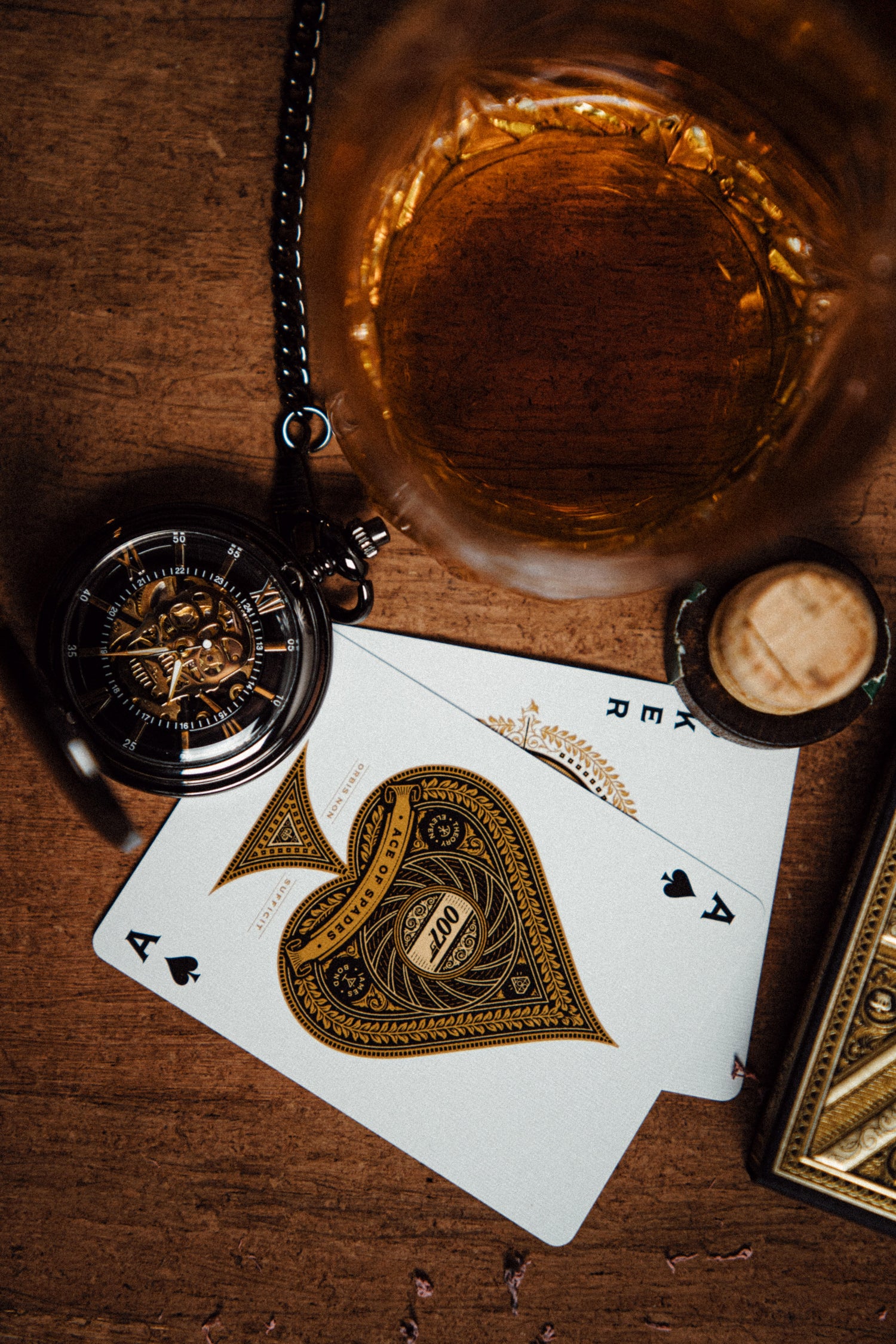 Dusan Jovic gold pocket watch. Gold variant next to playing cards.