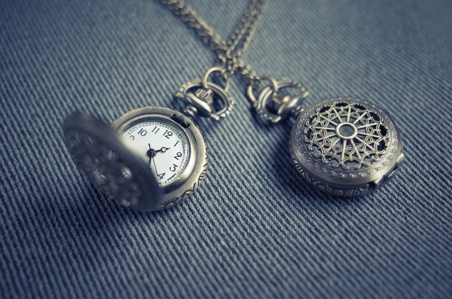 Elisha Terada silver engraved dual pocket watch. Silver variant with white face.