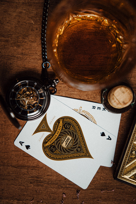 Dusan Jovic gold pocket watch. Gold variant next to playing cards.
