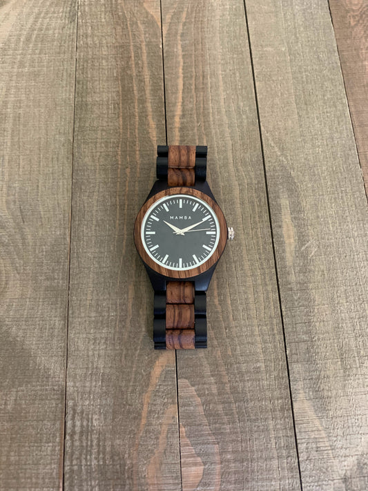 Mamba watch with unique wooden strap and face. Black trim with brown wood.