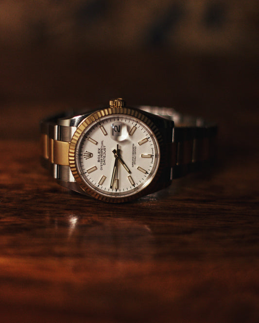 Yash Parashar watch with Oyster Perpetual Datejust made by Rolex. Luxury watch with silver and gold trim.